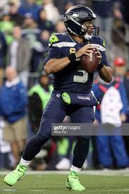 Russell Wilson Of The Seattle Seahawks Looks To Throw The Ball In The Wilson Seahawks Russell Wilson Russell Wilson Shirtless
