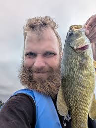 Body says smallmouth Eyes and pattern say rock bass Or is there a hybrid?