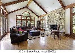 Family room, living room, great room, exposed beams, stone fireplace surround, built in cabinets, stained hardwoods. Family Room With Stone Fireplace Stock Images Page Everypixel