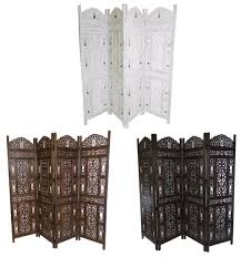 This wooden divider is truly a piece of art thanks to an ornate carved design that's sure to make it a centerpiece in your home. 4 Panel Hand Carved Indian Wooden Bells Design Folding Screen Room Divider