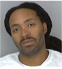 While one suspect in a quadruple Portsmouth murder case remains a fugitive,  the other is ordered held without bond