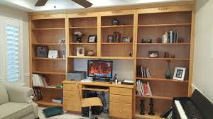 A folding wooden bookcase of dark stained birch or poplar. Built In Bookcase Makeover Don T Be Afraid To Paint Sawdust Sisters