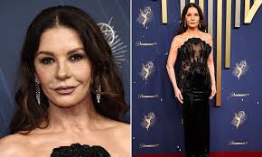Catherine Zeta-Jones, 55, turns heads as she goes braless beneath a  semi-sheer black gown at the 2025 Emmys
