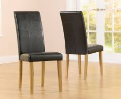 Sets with a blonde hue pair especially well with contemporary decor, while medium oak dining room chairs bring all the warmth of classic decorating to your table. Atlanta Black Faux Leather And Solid Oak Dining Chair