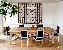 Treat your dining room like a old world library when you aren't entertaining and pile up your prettiest coffee table books in stacks. 10 Table Centerpiece Ideas For Every Occasion Architectural Digest