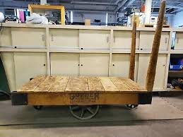 Factory/railroad cart used in the early 1900s.would make a beautiful coffee table.cart has been dismanteled cleaned , sanded and sealed with minwax polyurethane clear satin.but still has the rough rustic look that makes these old carts so beautiful. 1900 1950 Railroad Cart Coffee Table Vatican