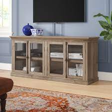 A tall tv stand is a good fit if you need your television out of the way and want additional storage space underneath. Three Posts Henley Tv Stand For Tvs Up To 80 Reviews Wayfair