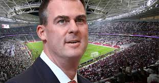 Questions surround Stitt's mysterious trip to World Cup in Qatar...