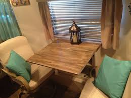 Took Out The Dinette And Bench Seats In The Camper Replaced Them With Swivel Patio Chairs And Built A Bookcase Drop Leaf Ta Camper Table Rv Decor Camper Decor