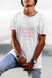 Get Your Swag On With This Mockup Template Of A Young Male Model Posing For The Camera Outdoors Place Your Design Onto The Clothing Mockup Shirt Mockup Shirts
