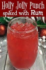Jolly Spiked Rum Holiday Punch Is A Delicious Combination Of Rum Strawberry And Cranb Holiday Punch Recipe Spiced Rum Drinks Christmas Drinks Alcohol Recipes
