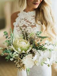 Decorating the humble wooden structure with local ferns and vines keeps the vision sympathetic to the surrounding. Boho Beach Wedding At La Playa Beach And Golf Resort Junebug Weddings
