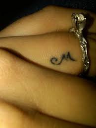 Initial Tattoo On Ring Finger Of Your Spouce Like A Monogram Saying I Am Yours And You Are Mine My Husband Would Finger Tattoos Trendy Tattoos Tattoo Fonts