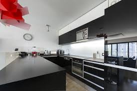 Ultra Modern Black U Shaped Kitchen With Red Art Fixture White Kitchen Interior White Modern Kitchen Modern Kitchen