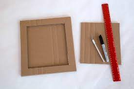 All you need are glue sticks and a glue gun, cardboard for the back and newspapers. Diy Cardboard Frame With Kids Art As A Handmade Gift Idea