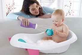 There is a bathtub with a pretend handheld water sprayer, a pretend bottle of soap, and a rubber ducky. 10 Best Baby Bath Tubs 2020 Unboxmom