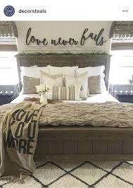 The Wooden Words On The Wall Behind The Bed I Love These Words Eric Farmhouse Style Master Bedroom Rustic Master Bedroom Farmhouse Bedroom Decor