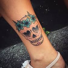 Sugar skull tattoo designs are typically designed with an oval shaped skull, possibly stated as a cartooned shape skull. 72 Beautiful Sugar Skull Tattoos With Images