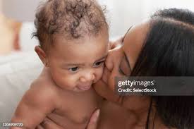 971 Black Woman Kissing Baby Stock Photos, High-Res Pictures, and Images
