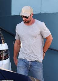 Chris Hemsworth enjoys a beer during a leisurely lunch with friends in  Sydney's Bondi