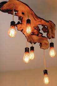 A boho type chandelier like this legit sells for. Pallet Chandelier Diy Wood Lamps Wood Lamps Wood Diy