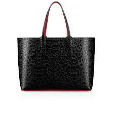 Christian Louboutin S Cabata Is A Go To Tote That Is As Sophisticated As It Is Versatile Black Metal Spiked Loops Anch Black Tote Bag Christian Louboutin Bags