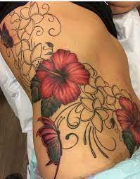 Belly Tattoos A Female Guide To The Do S And Don Ts Hibiscus Tattoo Belly Tattoos Hawaiian Flower Tattoos