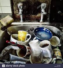 close up of squalid kitchen sink full
