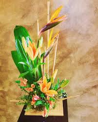 Bird Of Paradise Bouquet Care Start Your Week Off Right With A Tropical Floral Arrangement Featuring Lilies And Birds Of Paradise Modern Flower Arrangements Tropical Floral Arrangements Order Flowers Online