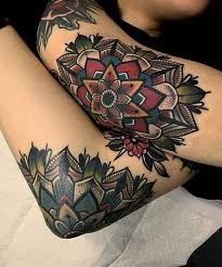This tattoo stands out because of its bold colour and intricate design. 99 Of The Coolest Designs For A Mandala Tattoo