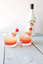 This delicious malibu sunset recipe will make you feel like you are on a tropical island. Malibu Sunset Cocktail Homemade Food Junkie Mixed Drinks Recipes Drinks Alcohol Recipes Alcohol Recipes