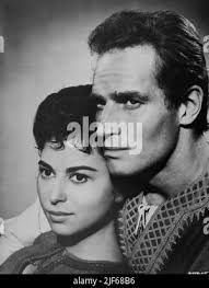 HAYA HARAREET and CHARLTON HESTON Portrait in BEN-HUR 1959 director WILLIAM  WYLER novel General Lew Wallace screenplay Karl Tunberg music Miklos Rozsa  costume design Elizabeth Haffenden producer Sam Zimbalist Metro Goldwyn  Mayer
