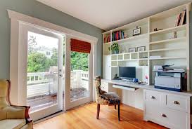 Small home office with large windows, floating shelves, and wood flooring. 28 Creative Small Home Office Ideas Designing Idea