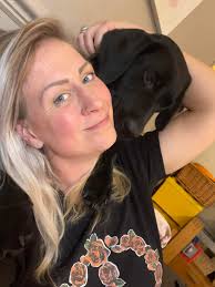 Cat hanging from tree with cute paw bend