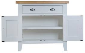 The colonial white base includes an open shelf, two enclosed shelf sections with doors, a lower central drawer and three upper drawers. Oak Furniture Oak Furniture Spain