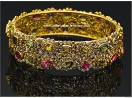 Beautiful Bangle Embellished With Uncut Or Chakri Diamonds And Gemstones Tanishq Jewellery Bangles Jewelry Designs Jewelry