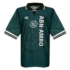 The black kit features red, yellow and green details. Ajax Football Shirt Archive