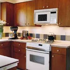 Groups the appliances together for a sleek, integrated look. Making Room For The Microwave This Old House