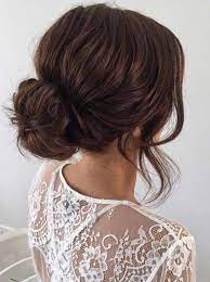Messy Bun With Curled Strands To Frame The Brides Face Hair Styles Bun Hairstyles For Long Hair Long Hair Styles