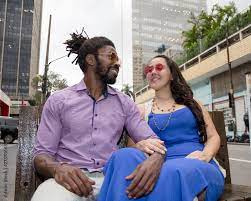 Asian girl and black man dating and having fun in the street. Multiethnic  brazilian couple. Stock 写真 
