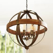 Bent wood staves strapped with a metal loop make this wine barrel chandelier, a retro. Wood Metal Orb Chandelier Gracefully Restored Home