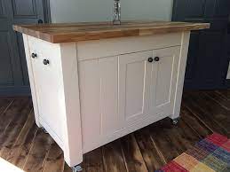 Cheshire cream painted small kitchen island with granite top. Freestanding Kitchen Islands