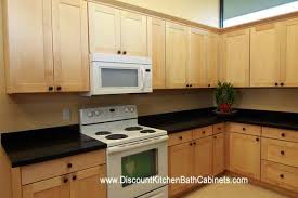 Natural maple kitchen cabinets with sleek lines paired with an impressive stainless range hood create an inspired contemporary look. Natural Maple Shaker Kitchen Cabinets M47 Dkbc Discount Kitchen Bath Cabinets
