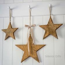 Driftwood star hung on front porch with skis, poles and craftsman sconce. Vintage Wooden Stars In Natural Set Of 3 Solid Hanging Stars From Retreat Home Small Medium And Large
