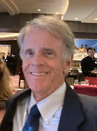 Can you identify the people in the class photo?