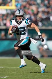 Christian Mccaffrey Of The Carolina Panthers Runs The Ball Against Christian Mccaffrey Carolina Panthers Football Carolina Panthers