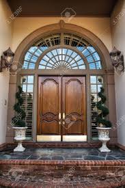 Replacing your front entrance door is a simple swap that enhances your home's curb appeal. House Plans With Front Double Doors Entrance Grand Double Door Entrance 14351rk Architectural Designs House Plans The Double Glazed Front Doors Give The Stunning Security To The Living Property Unas Decoradas