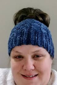 Ravelry: Interlocking Shells Messy Bun Hat pattern by Ashley Lintner