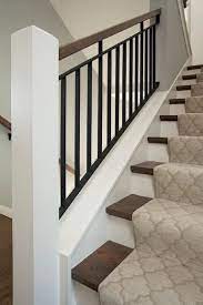 Staircase with iron spindles and gray herringbone. Pin On Design Space