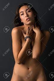 Beautiful Young Asian Woman Standing Nude Against A Gray Wall Stock Photo,  Picture and Royalty Free Image. Image 35009664.